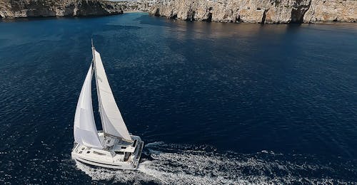 Catamaran Trip along the Coast of Santorini with Swimming & Lunch.